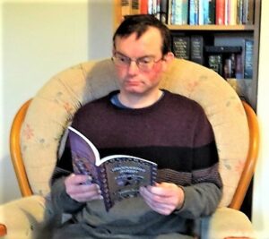 Matthew Ansell with his new book of poetry and artwork Understanding Autism: A Book of Poetry